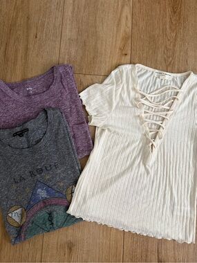 3 Urban Outfitters Tops: Cream Ribbed Lace-Up Short Sleeve Top + 2 tees